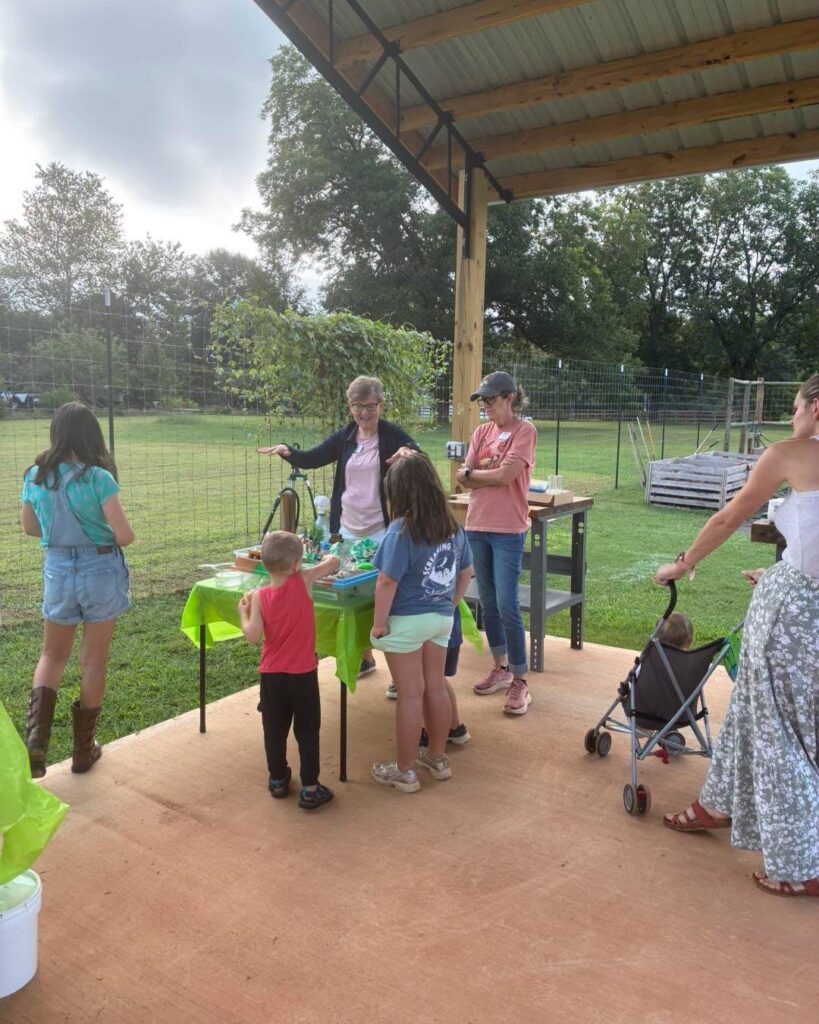 Master Gardeners teaching children about the environment using a EnviroScape.