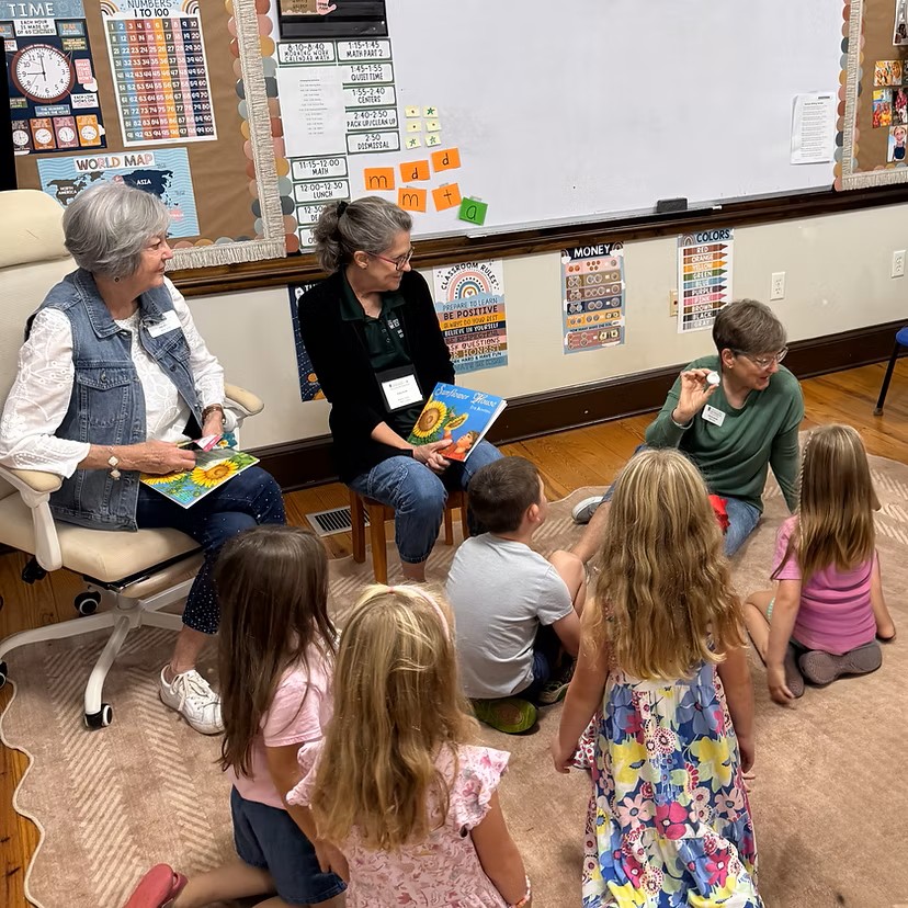 Master Gardeners teaching children about gardening in the Master Gardener Sprouts program.